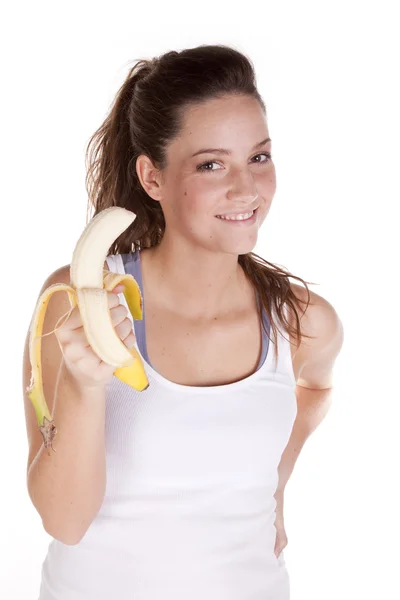 Femme heureuse tenant une banane — Photo