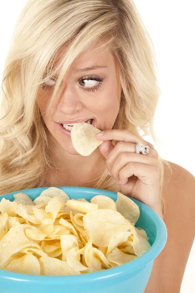 stock image Woman eating chip caught