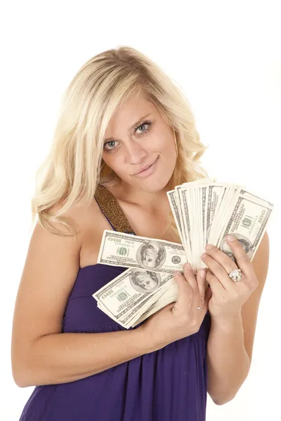 Woman purple handful of money — Stock Photo, Image