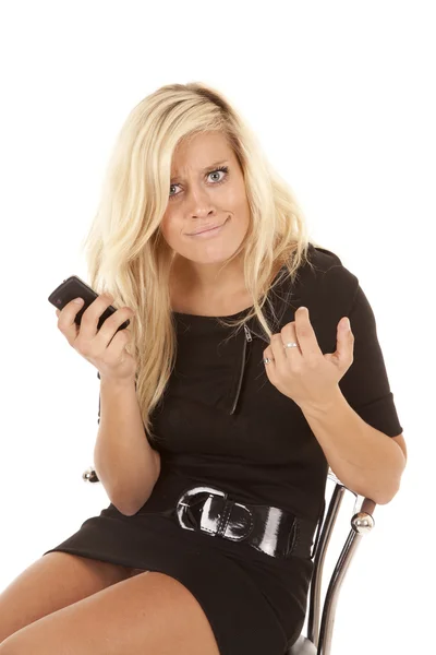 Woman puzzled phone black dress — Stock Photo, Image