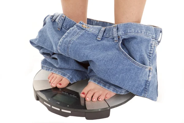 Big pants down on scales — Stock Photo, Image