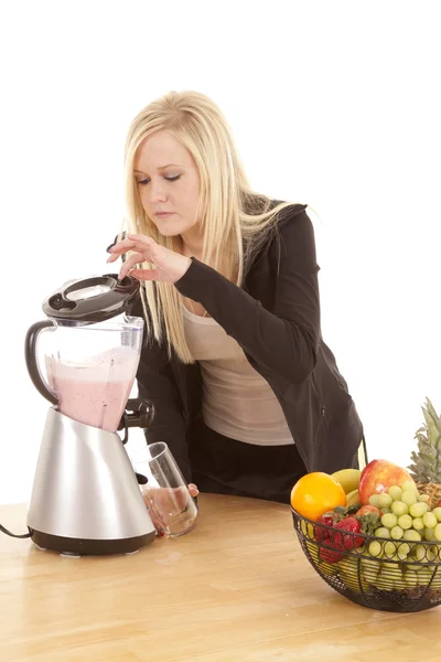 Woman looking in blender — Stock Photo, Image
