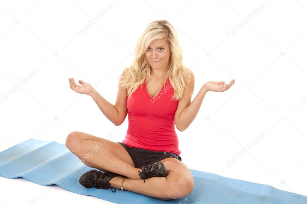 Woman red top unsure yoga mat