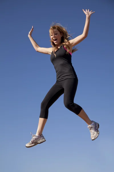 Woman black clothes jumping — Stock Photo, Image