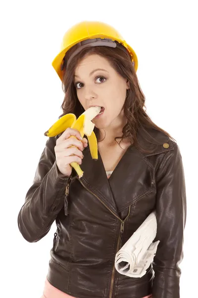 Construction woman eat banana — Stock Photo, Image