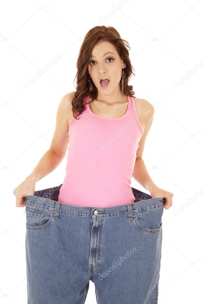 Happy Brunette Woman Showing Weight Loss Wearing Huge Denim Jeans Stock  Photo by ©Fotosmurf 403343482