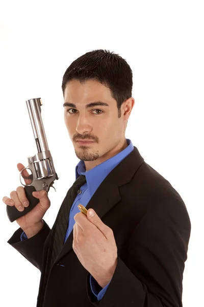 Business man holding gun and bullet — Stock Photo, Image