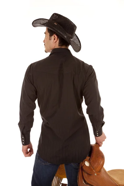 Cowboy back with saddle — Stock Photo, Image