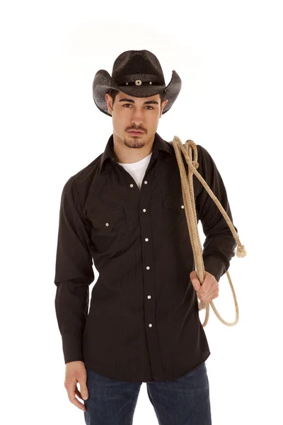 Cowboy segurando corda sobre o ombro — Fotografia de Stock
