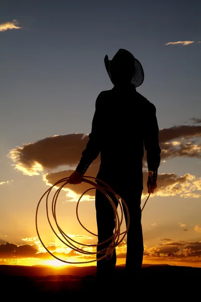 Cowboy silhueta corda para baixo — Fotografia de Stock