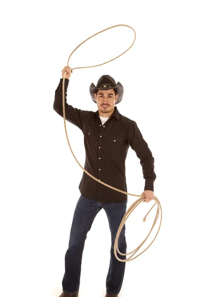 Cowboy with rope in air — Stock Photo, Image