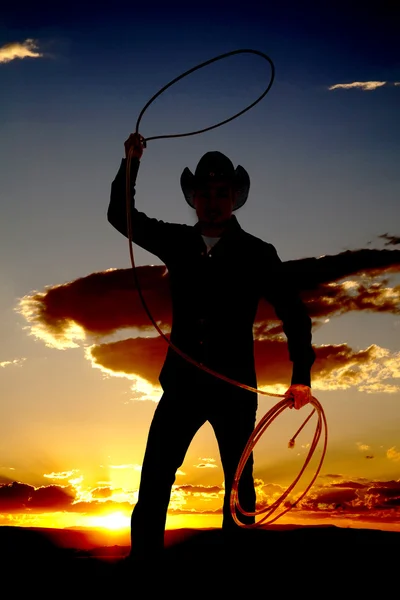 Cowboy with rope in air sunset — Stock Photo, Image