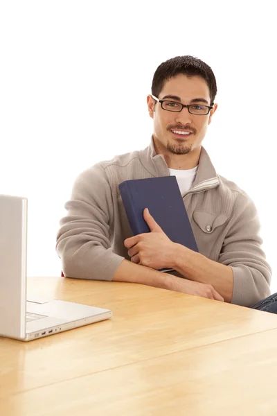 Man holding book in arms — Stock Photo, Image