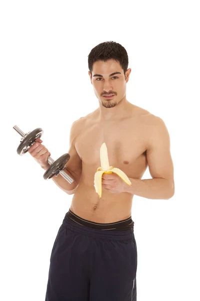 Man with weight and banana — Stock Photo, Image