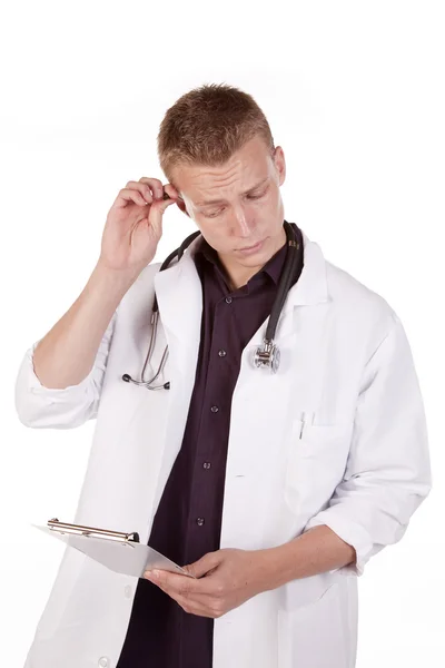 Doctor looking at chart — Stock Photo, Image