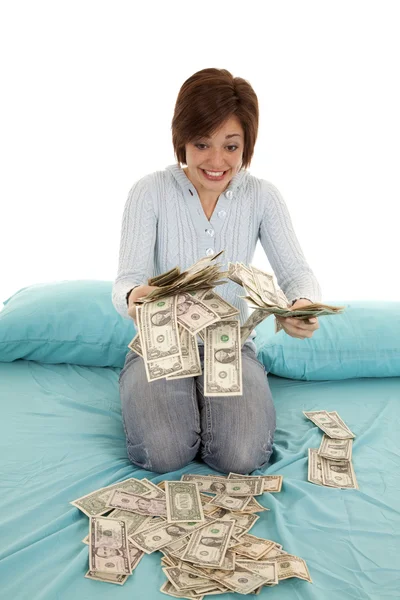 Garść pieniędzy łóżko — Zdjęcie stockowe