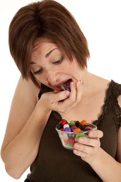 Putting jelly beans mouth — Stock Photo, Image