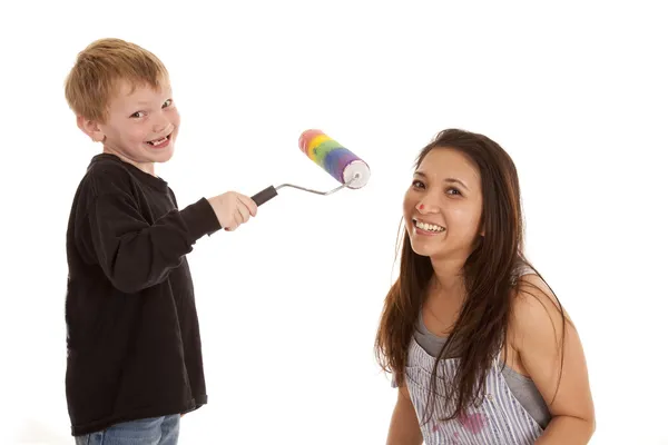 Boy with paint roller woman face — Stock Photo, Image