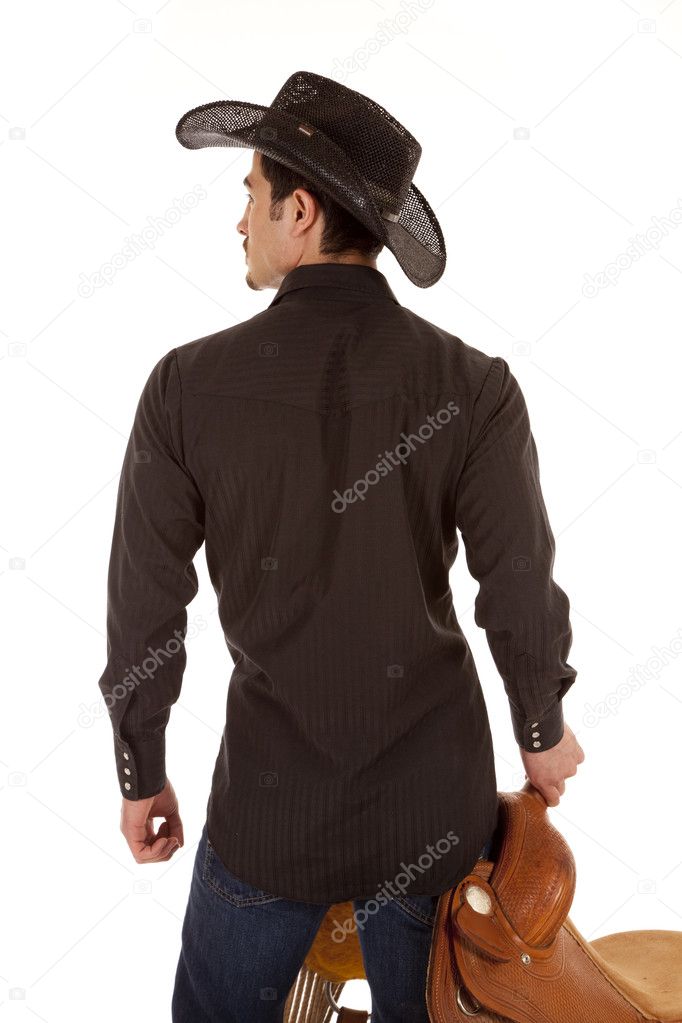 Cowboy back with saddle
