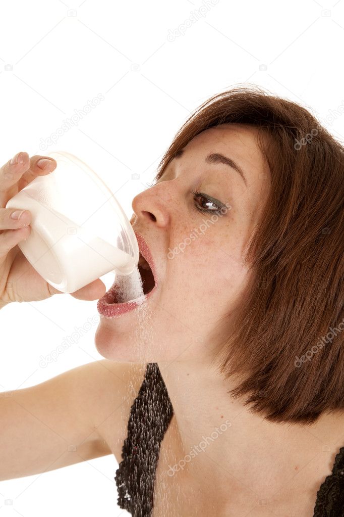 Pouring sugar in mouth