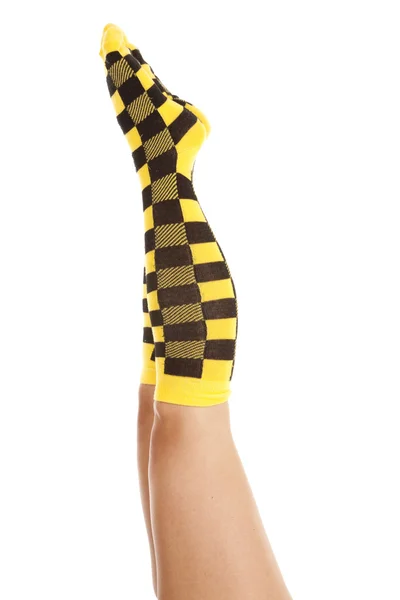 Woman socks yellow black both up — Stock Photo, Image