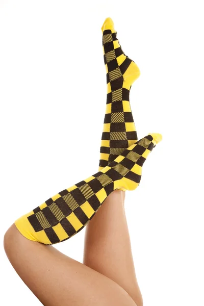 Woman socks yellow black one up — Stock Photo, Image