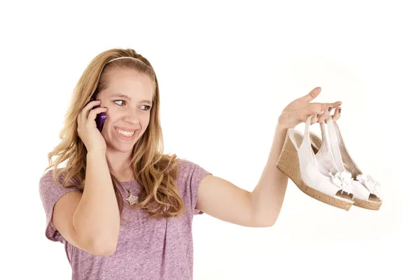 Girl with shoes on phone — Stock Photo, Image