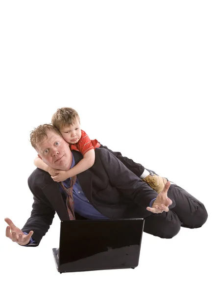 Child hanging on father computer — Stock Photo, Image