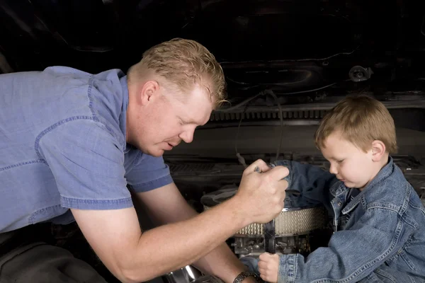Father and son working together — Stock Photo, Image