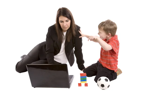 Mom working son playing — Stock Photo, Image