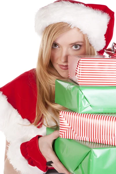 Mrs Santa looking around stack presents — Stock Photo, Image