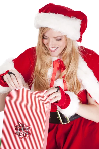 Mrs Santa wraps a gift — Stock Photo, Image