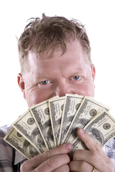 Man peeking from behind money Stock Image