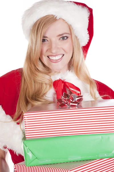 Mrs Santa holding presents big smile Stock Picture