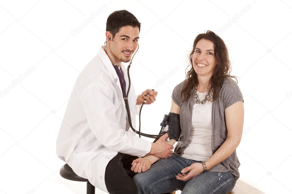 A doctor and patient smiling during a check up