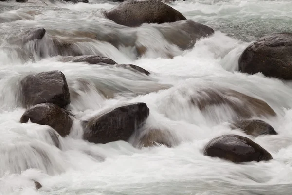 Water rolling over rocks