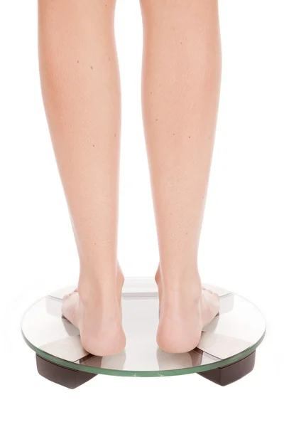 Womans feet scales back — Stock Photo, Image