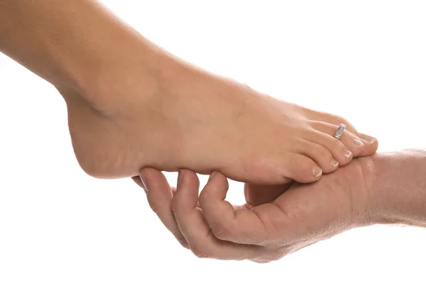 Man holding woman feet — Stock Photo, Image