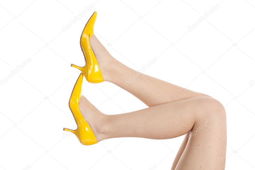 Woman legs yellow shoes
