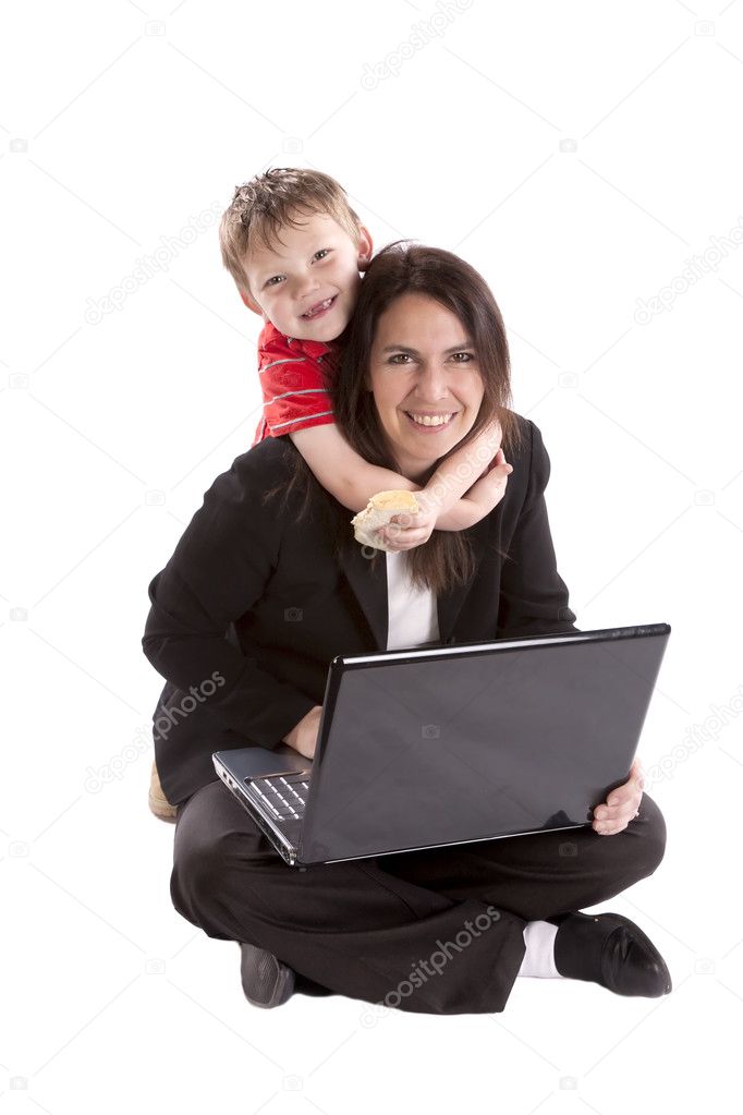 Woman working and son on neck.