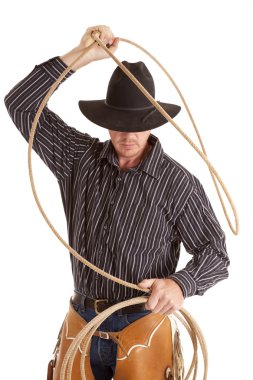 Cowboy with rope over head clipart