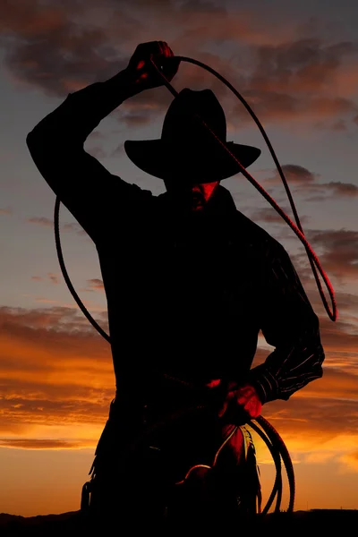 Cowboy in sunset with rope — Stock Photo, Image