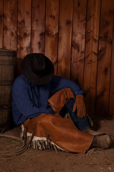 Cowboy sit by barrel sleep — Stock Photo, Image