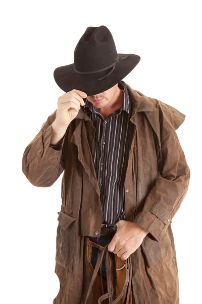Kovboj s prachovkou držel klobouk — Stock fotografie