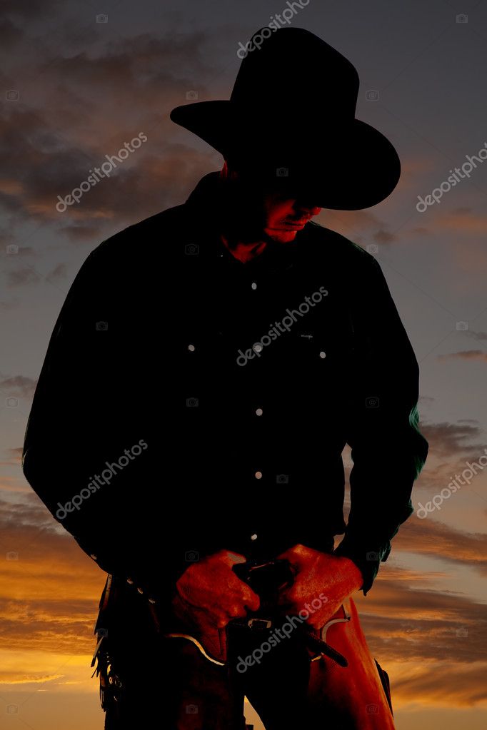 Cowboy in sunset looking down Stock Photo by ©alanpoulson 12101573