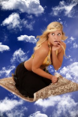 Genie on a flying carpet clipart