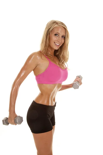 Kvinna rosa sport bh svett leende vikter — Stockfoto