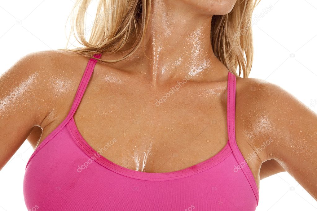 A Woman With Sweat On Her And A Pink Sports Bra. Stock Photo