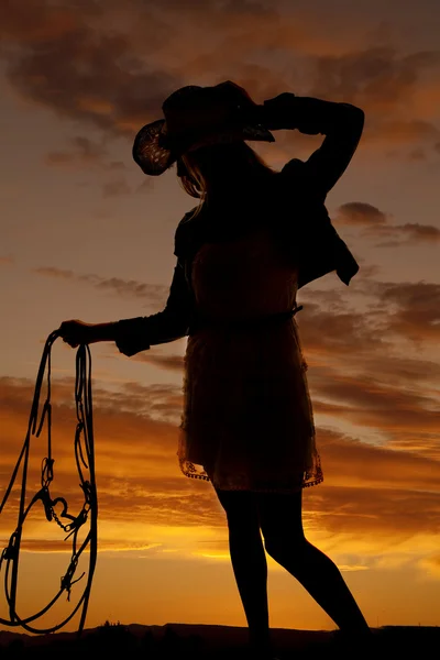 Woman hold bridle sunset — Stock Photo, Image