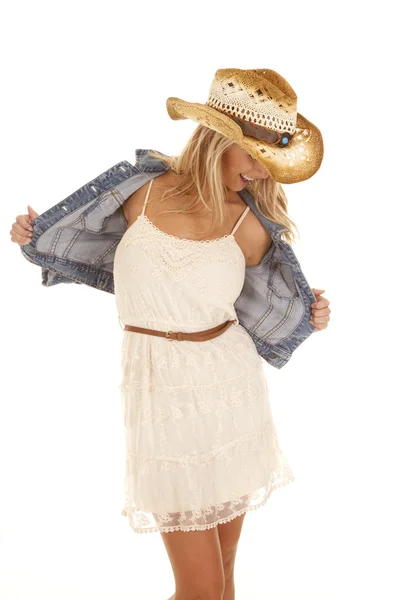 Cowgirl holding out jacket — Stock Photo, Image